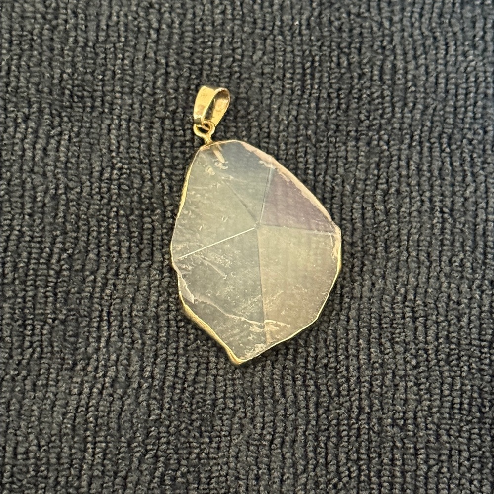 Genuine clear quartz pendant.